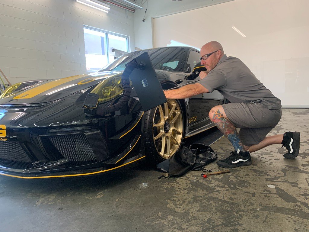 PDR technician working on a Porsche GT3