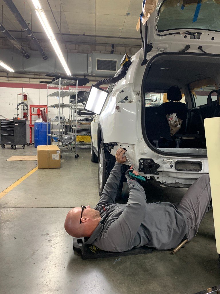 Mobile paintless dent repair on an SUV